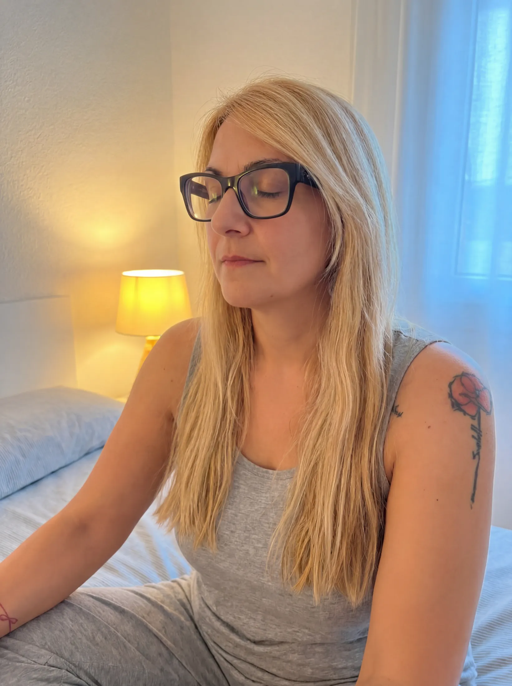 Melania sitting on her bed in the evening